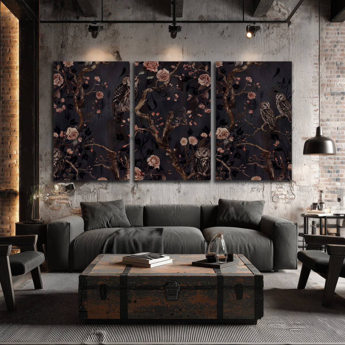 Owls among curling branches and dusty pink flowers on dark gray 3 piece canvas wall art displayed in a industrial room