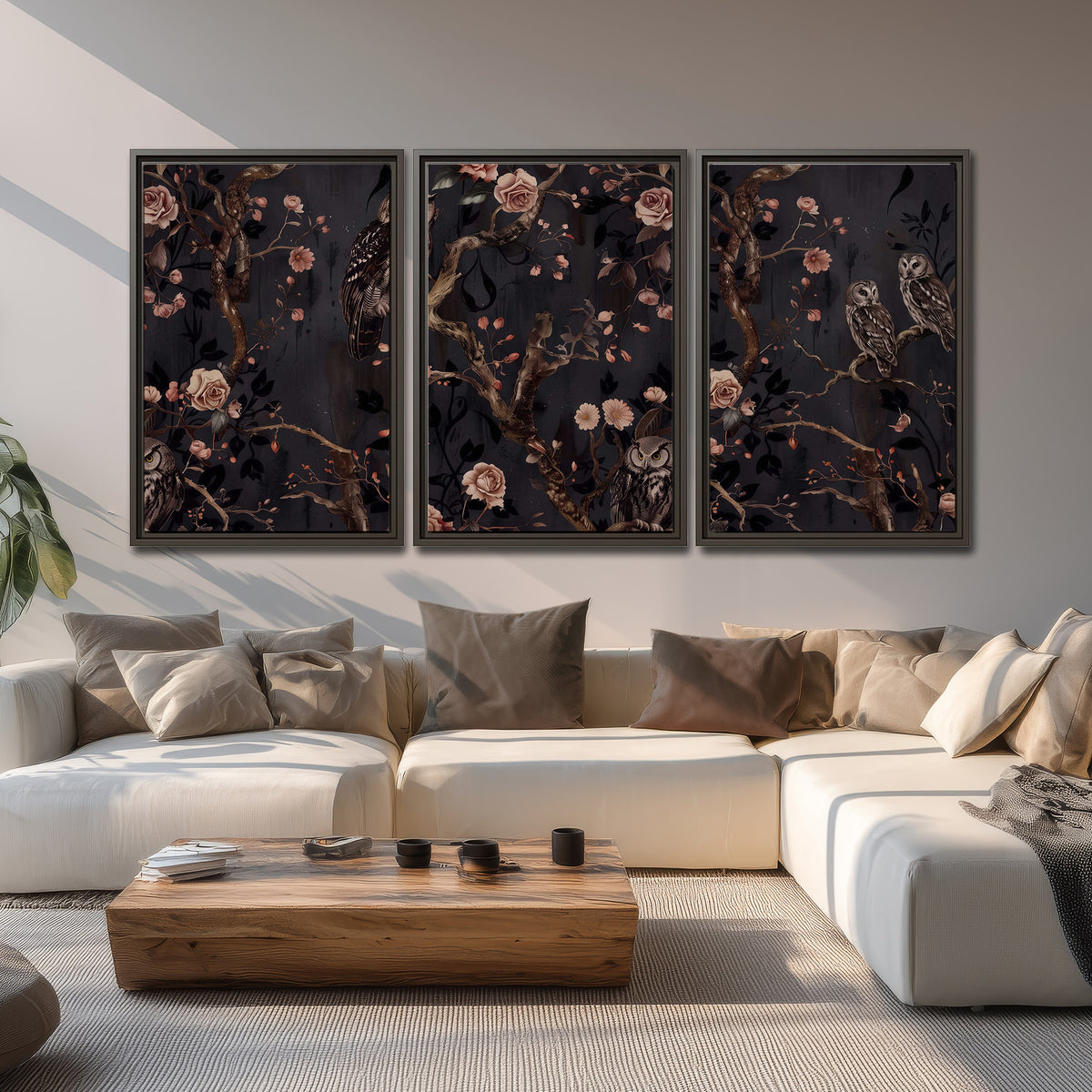 Owls among curling branches and dusty pink flowers on dark gray 3 piece framed canvas wall art displayed in a living room