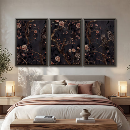 Owls among curling branches and dusty pink flowers on dark gray 3 piece framed canvas wall art displayed in a bedroom