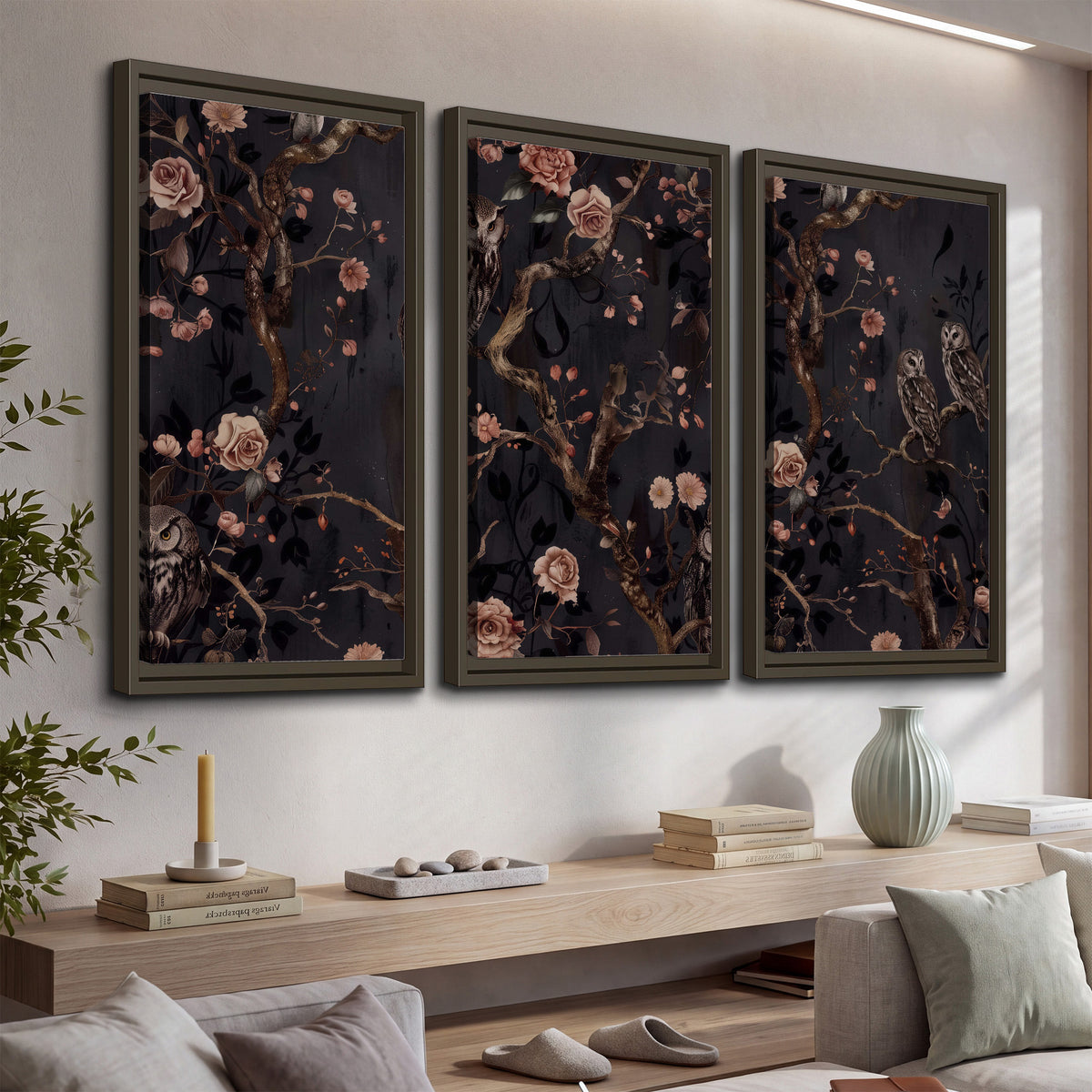 Owls among curling branches and dusty pink flowers on dark gray 3 piece framed canvas wall art displayed in a console