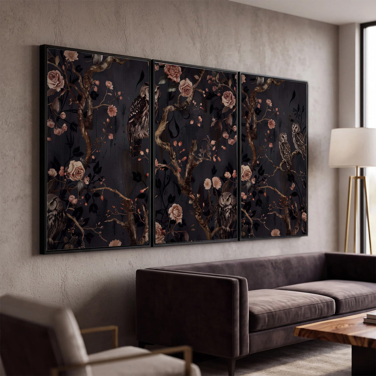 Owls among curling branches and dusty pink flowers on dark gray 3 piece framed canvas wall art displayed in a modern living room