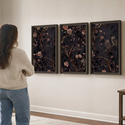 Owls among curling branches and dusty pink flowers on dark gray 3 piece framed canvas wall art three panel arrangement on a wall