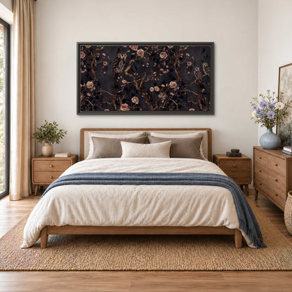 Owls among curling branches and dusty pink flowers on dark gray single framed canvas wall art styled in an interior