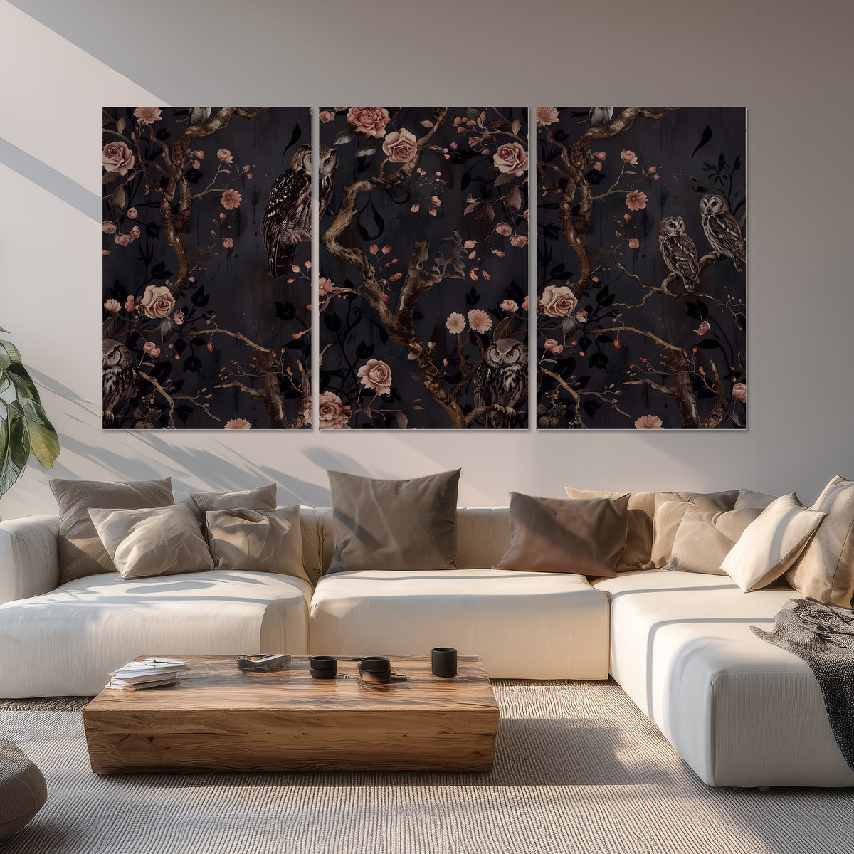 Owls among curling branches and dusty pink flowers on dark gray set of 3 poster prints displayed in a living room