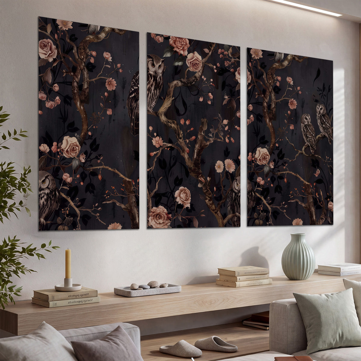 Owls among curling branches and dusty pink flowers on dark gray set of 3 poster prints displayed in a console