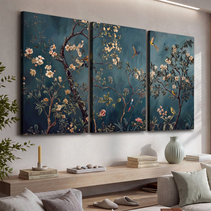 Colorful birds and pale blossoms on branches against teal blue 3 piece canvas wall art displayed in a console