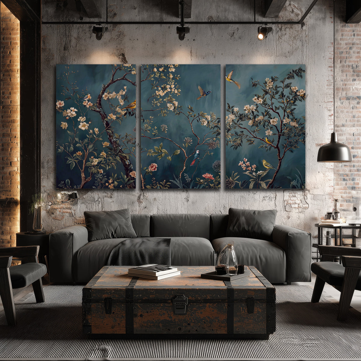 Colorful birds and pale blossoms on branches against teal blue 3 piece canvas wall art displayed in a industrial room