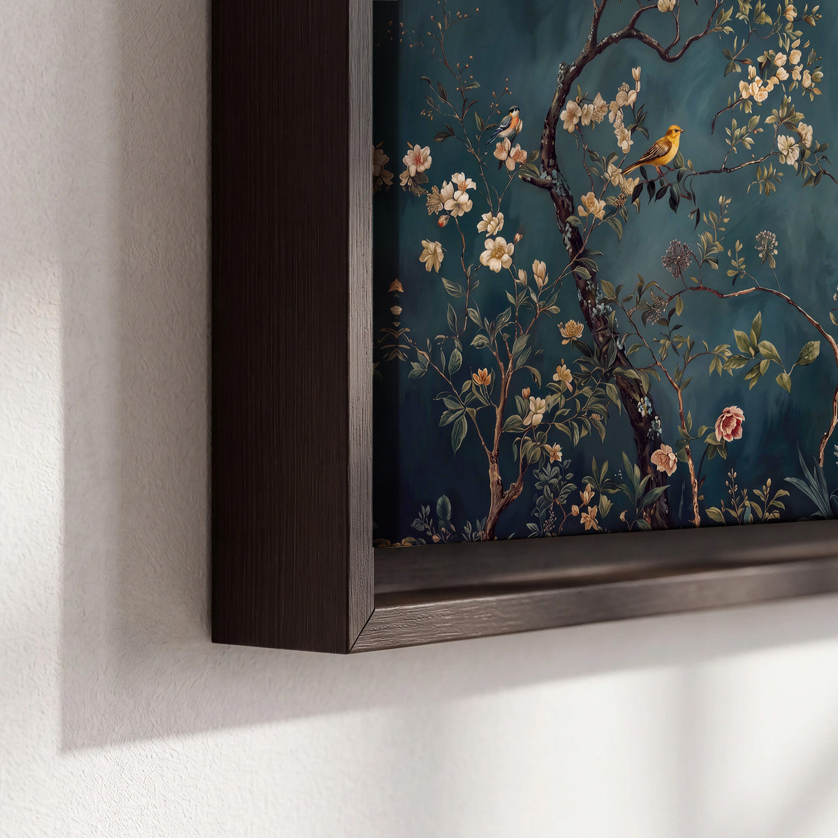 Colorful birds and pale blossoms on branches against teal blue 3 piece framed canvas wall art material and edge close up