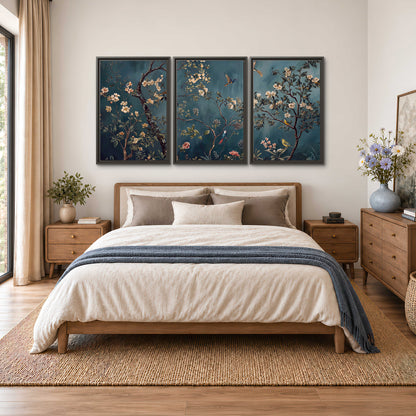 Colorful birds and pale blossoms on branches against teal blue 3 piece framed canvas wall art styled in an interior