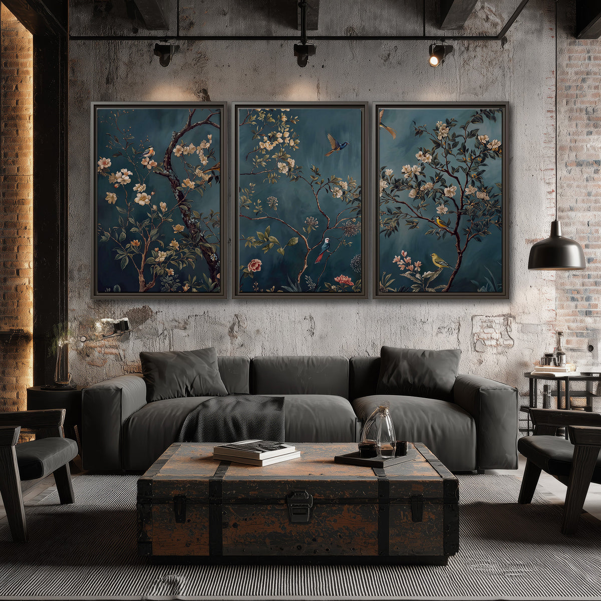 Colorful birds and pale blossoms on branches against teal blue 3 piece framed canvas wall art displayed in a industrial room