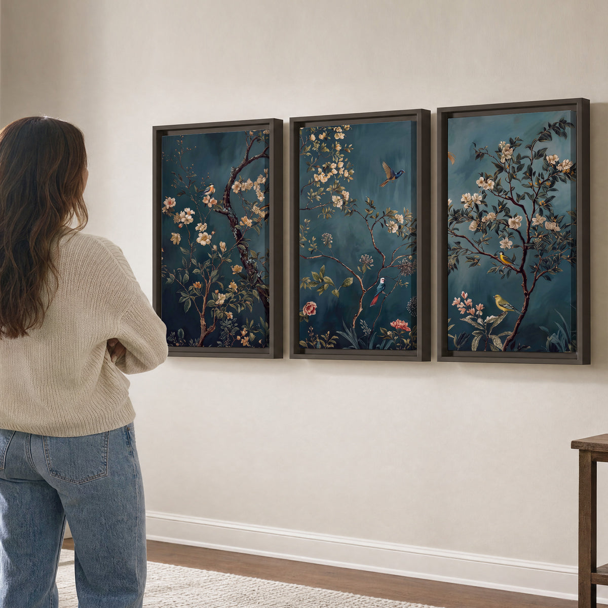 Colorful birds and pale blossoms on branches against teal blue 3 piece framed canvas wall art three panel arrangement on a wall