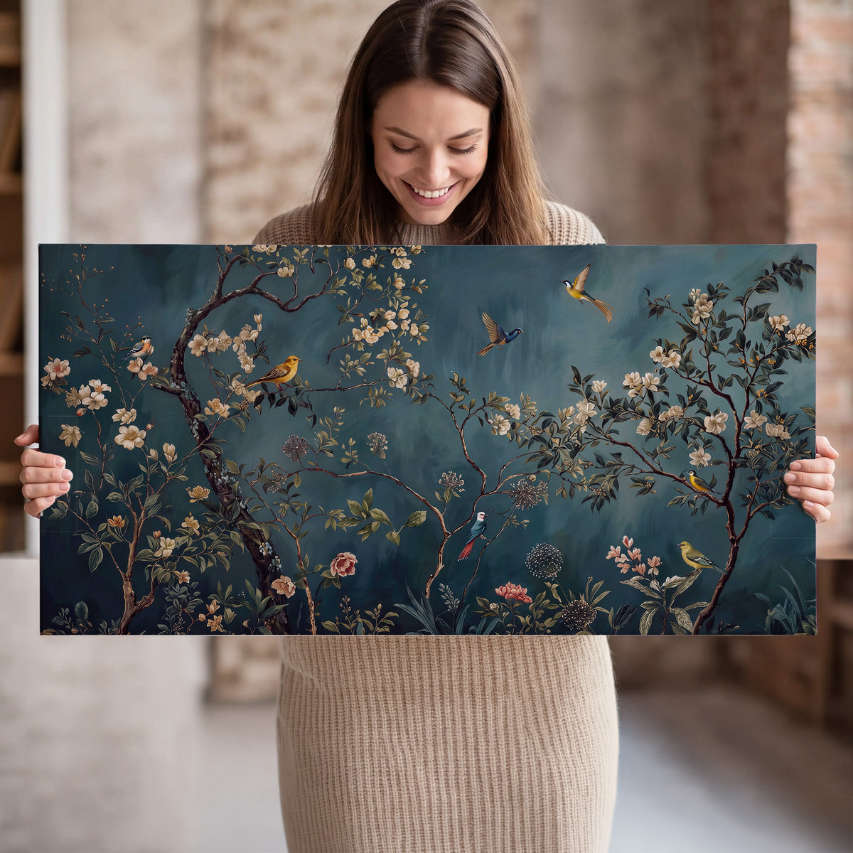 Colorful birds and pale blossoms on branches against teal blue single canvas wall art held in hands