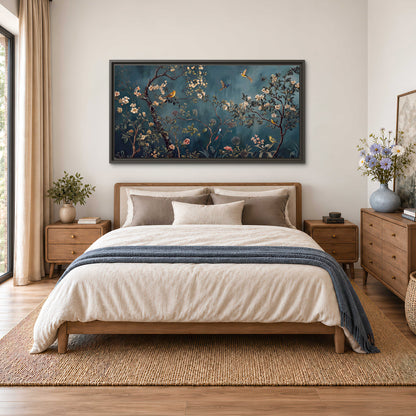 Colorful birds and pale blossoms on branches against teal blue single framed canvas wall art styled in an interior