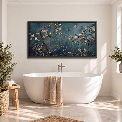 Colorful birds and pale blossoms on branches against teal blue single framed canvas wall art styled in an interior