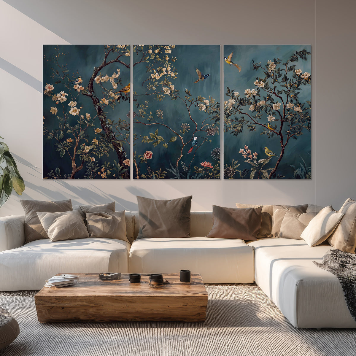 Colorful birds and pale blossoms on branches against teal blue set of 3 poster prints displayed in a living room