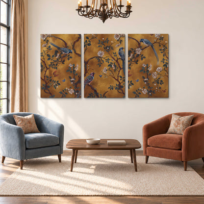 Colorful perched birds and pale blossoms on an ochre background 3 piece canvas wall art styled in an interior