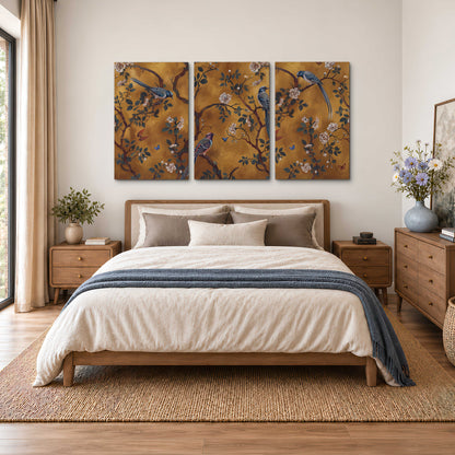 Colorful perched birds and pale blossoms on an ochre background 3 piece canvas wall art styled in an interior