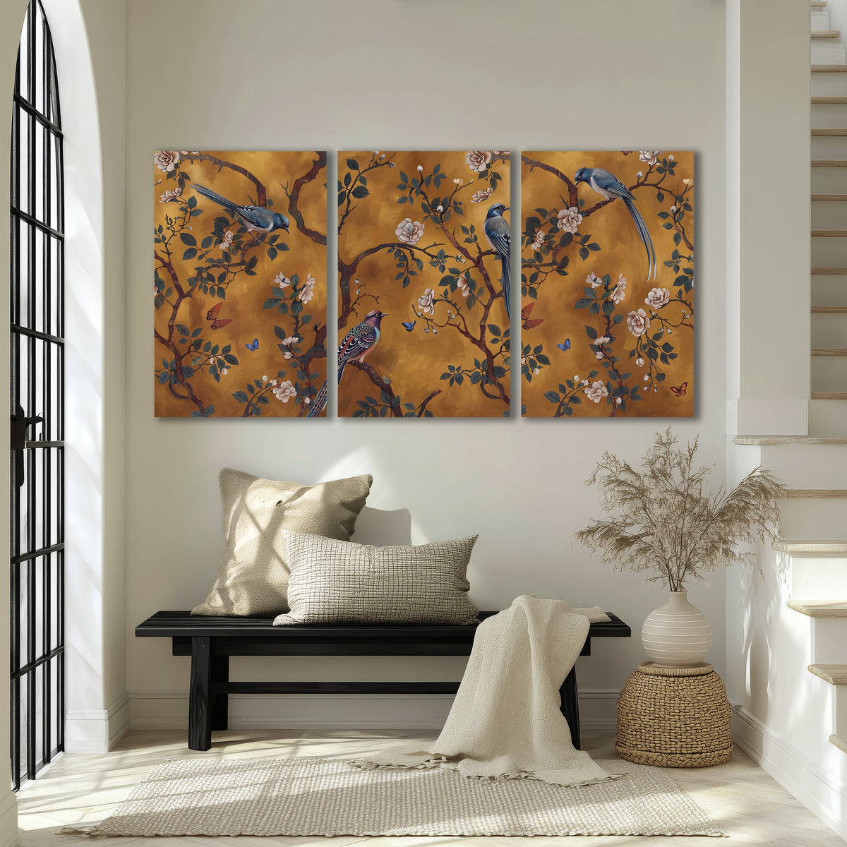 Colorful perched birds and pale blossoms on an ochre background 3 piece canvas wall art displayed in a entryway