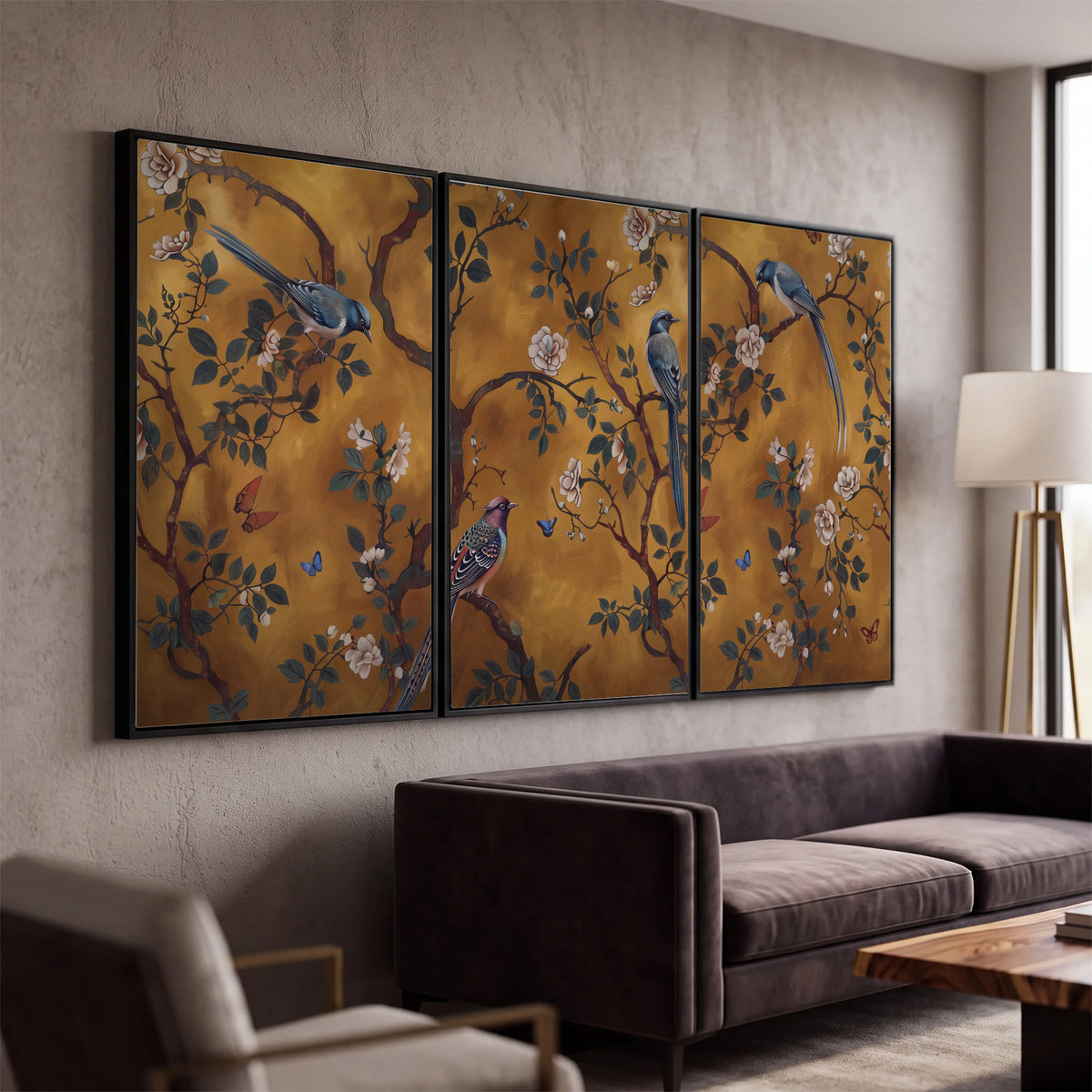 Colorful perched birds and pale blossoms on an ochre background 3 piece framed canvas wall art displayed in a modern living room