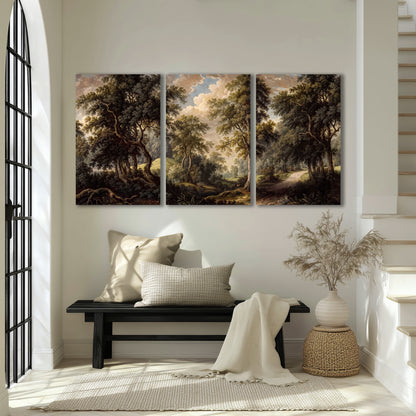 Old trees framing a softly lit woodland path 3 piece canvas wall art displayed in a entryway