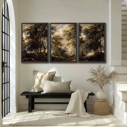 Old trees framing a softly lit woodland path 3 piece framed canvas wall art displayed in a entryway