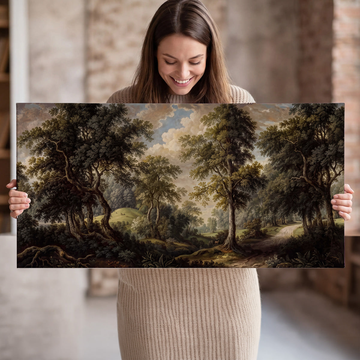 Old trees framing a softly lit woodland path single canvas wall art held in hands