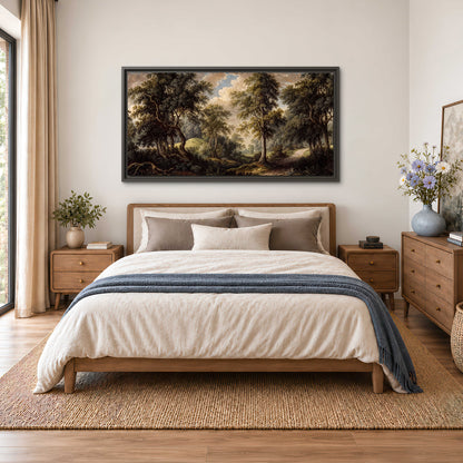 Old trees framing a softly lit woodland path single framed canvas wall art styled in an interior
