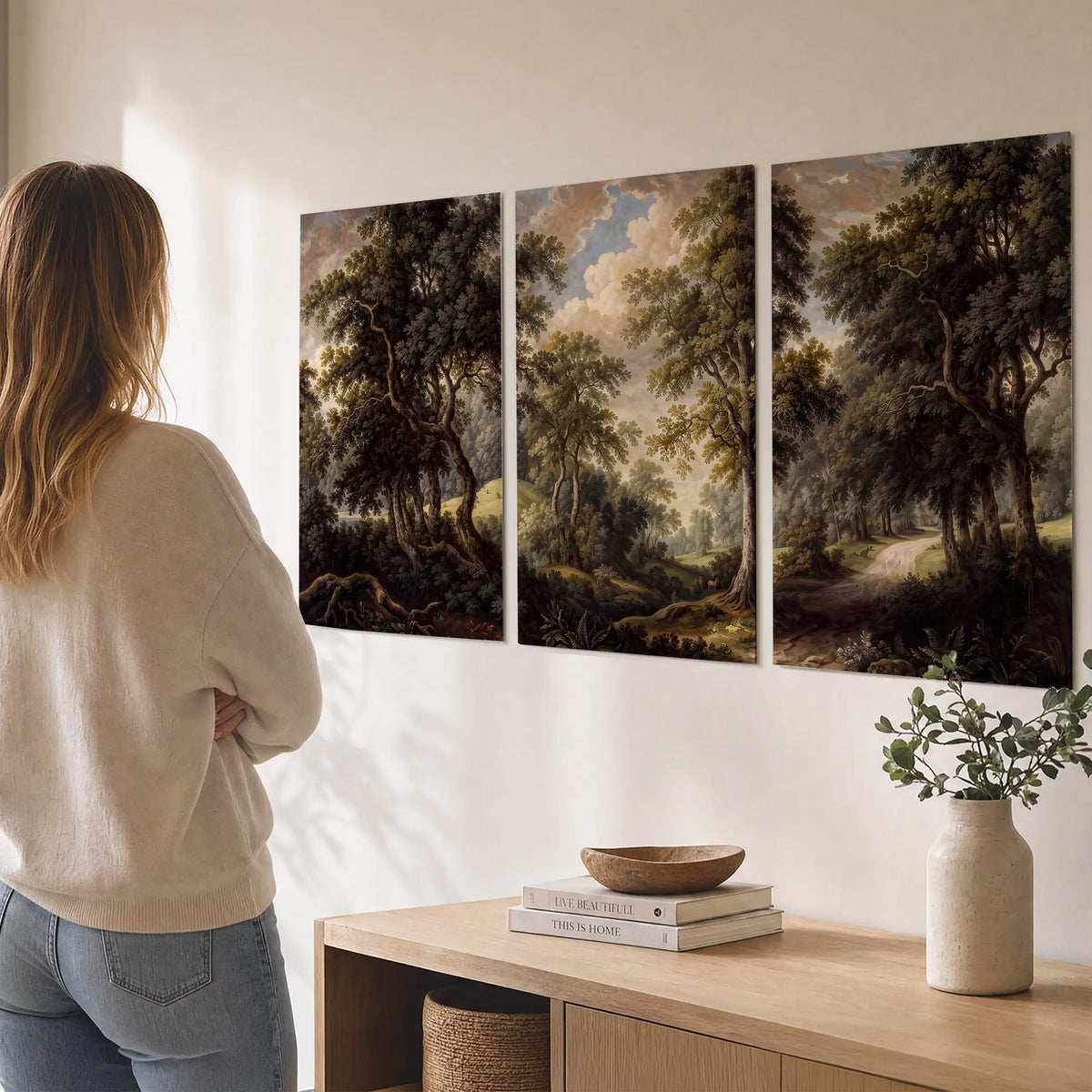 Old trees framing a softly lit woodland path set of 3 poster prints three panel arrangement on a wall