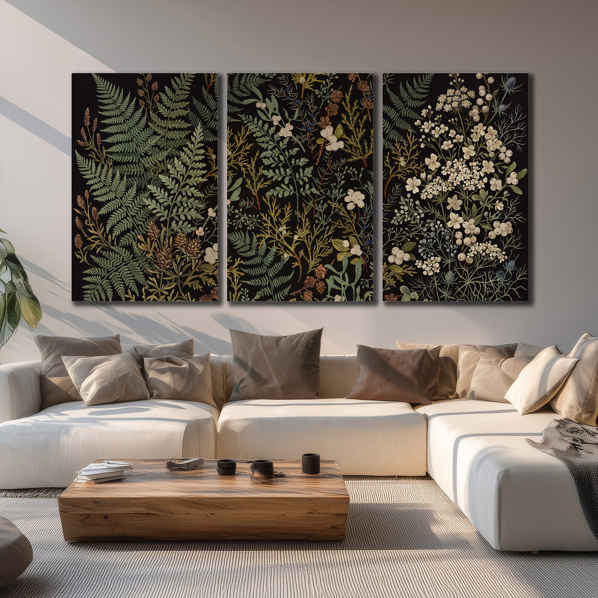 Layered green ferns and delicate cream flowers on a black background 3 piece canvas wall art displayed in a living room