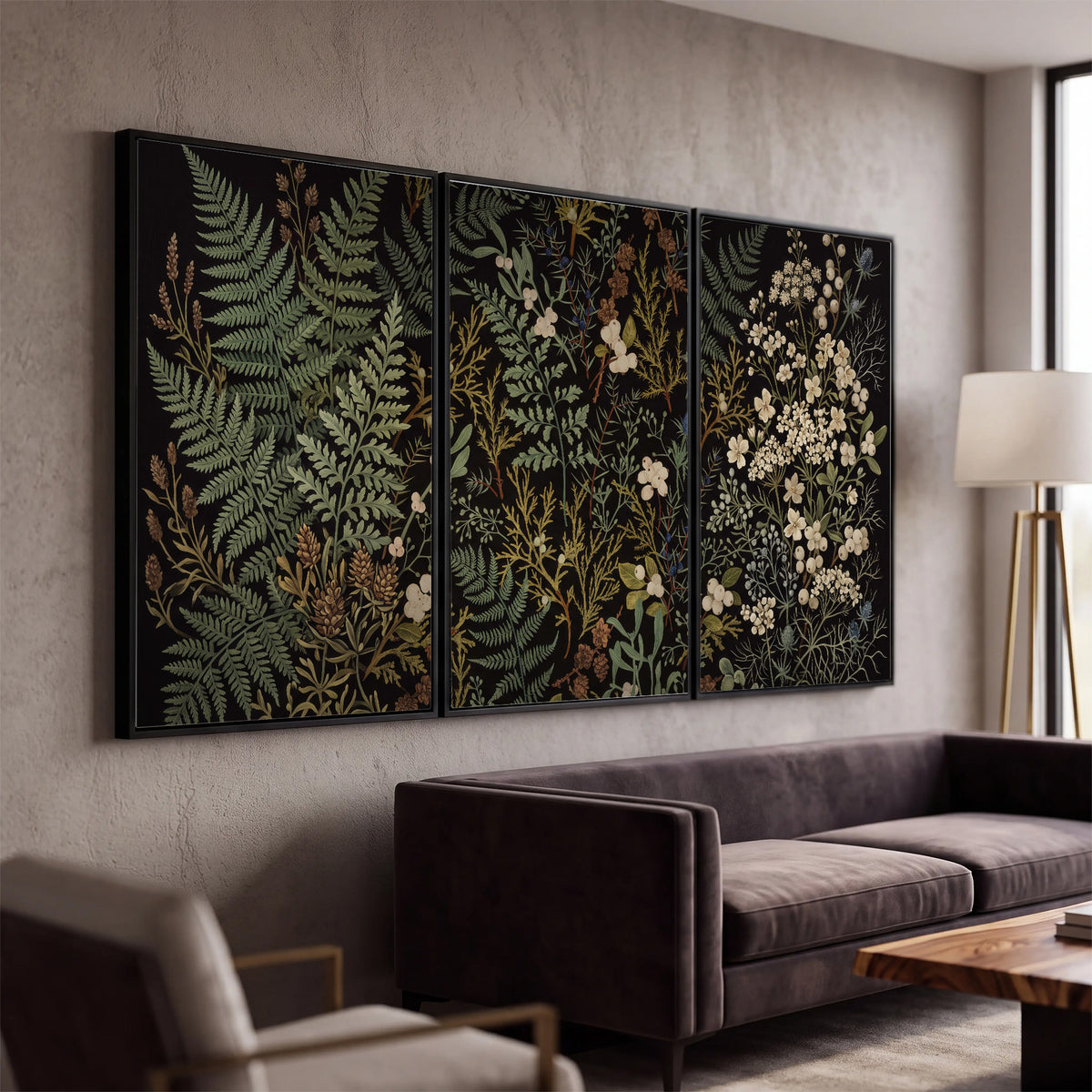 Layered green ferns and delicate cream flowers on a black background 3 piece framed canvas wall art displayed in a modern living room