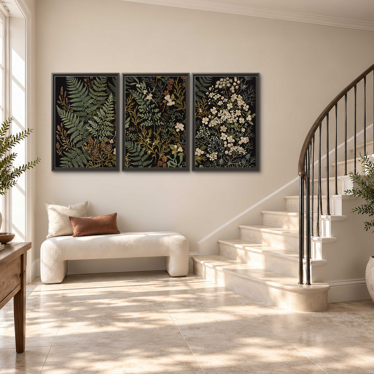 Layered green ferns and delicate cream flowers on a black background 3 piece framed canvas wall art styled in an interior