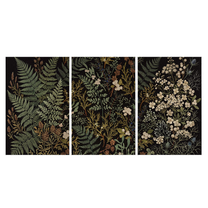 Layered green ferns and delicate cream flowers on a black background set of 3 poster prints viewed straight on