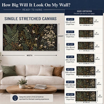 Layered green ferns and delicate cream flowers on a black background single canvas wall art size guide above a sofa; room view is illustrative