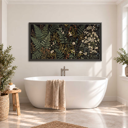 Layered green ferns and delicate cream flowers on a black background single framed canvas wall art styled in an interior