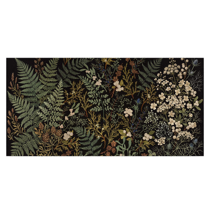 Layered green ferns and delicate cream flowers on a black background single poster print viewed straight on