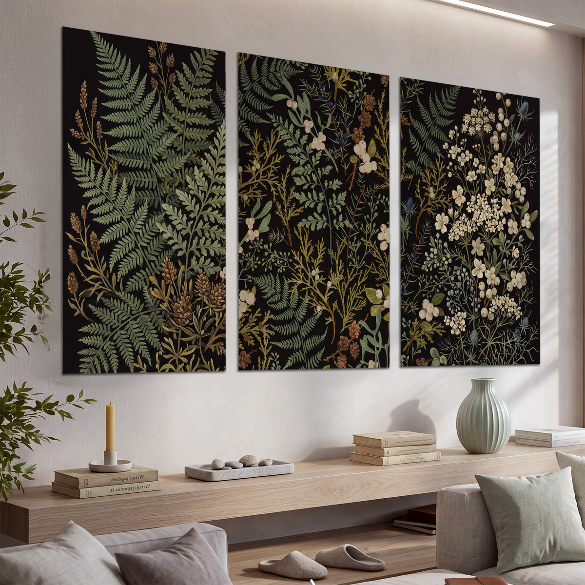Layered green ferns and delicate cream flowers on a black background set of 3 poster prints displayed in a console