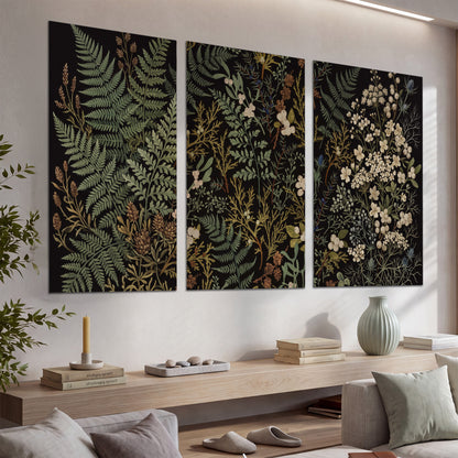 Layered green ferns and delicate cream flowers on a black background set of 3 poster prints displayed in a console