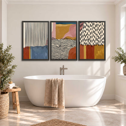 Terracotta, pink, mustard and blue shapes with black line patterns 3 piece framed canvas wall art styled in an interior