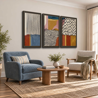 Terracotta, pink, mustard and blue shapes with black line patterns 3 piece framed canvas wall art styled in an interior