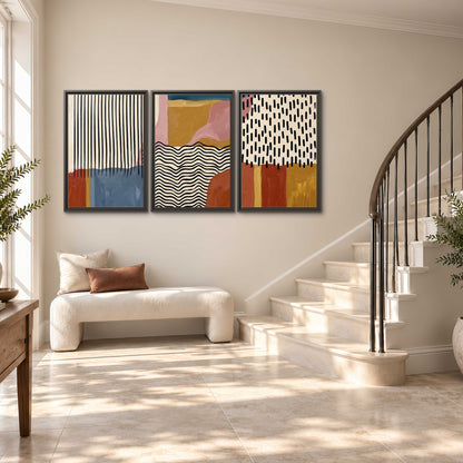 Terracotta, pink, mustard and blue shapes with black line patterns 3 piece framed canvas wall art styled in an interior