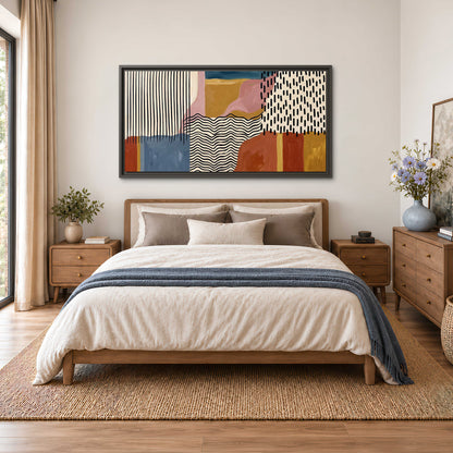 Terracotta, pink, mustard and blue shapes with black line patterns single framed canvas wall art styled in an interior