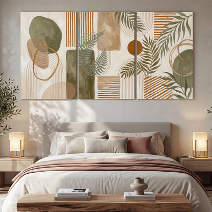 Green botanical leaves layered with ochre and cream geometric forms 3 piece canvas wall art displayed in a bedroom