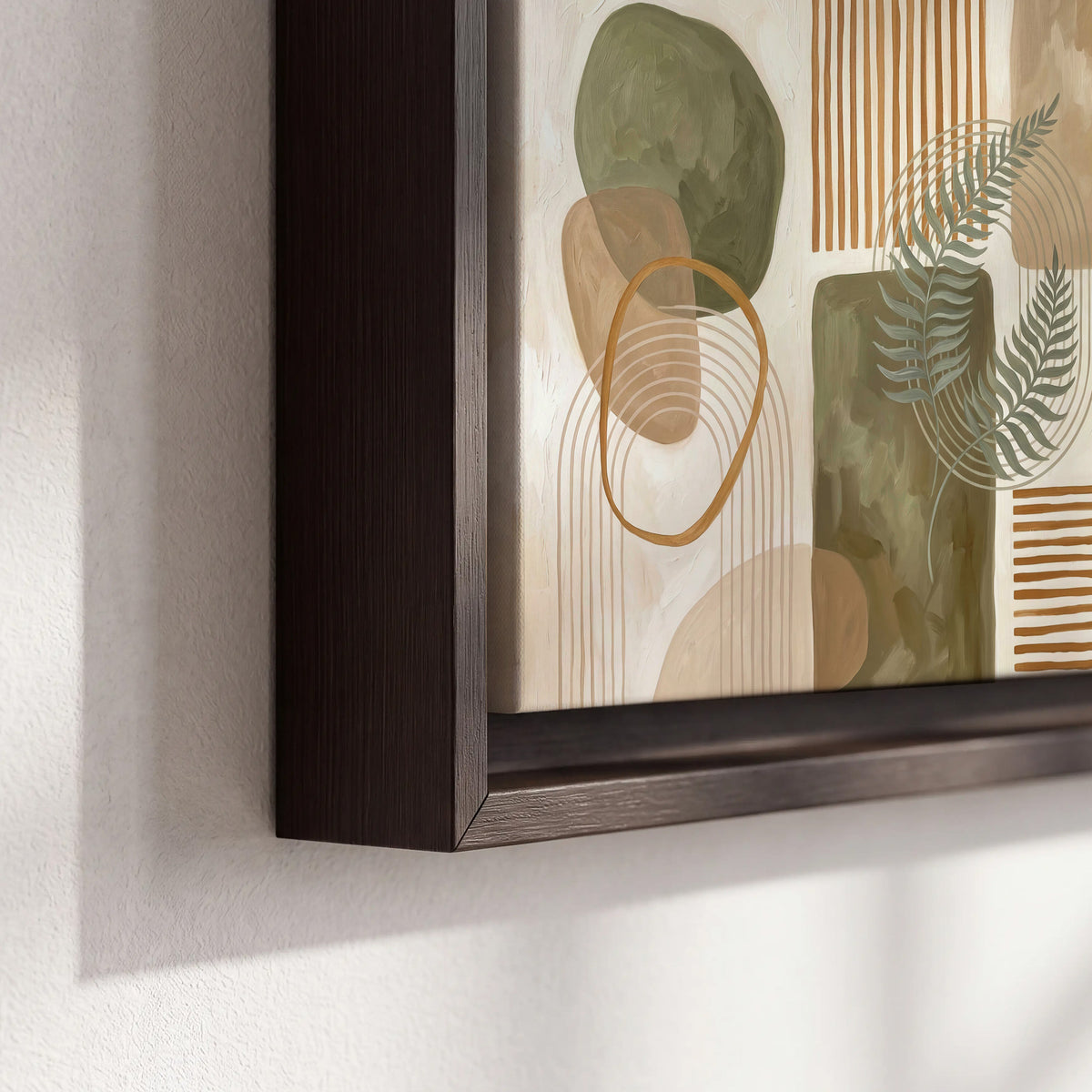 Green botanical leaves layered with ochre and cream geometric forms 3 piece framed canvas wall art material and edge close up