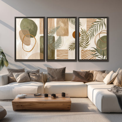Green botanical leaves layered with ochre and cream geometric forms 3 piece framed canvas wall art displayed in a living room