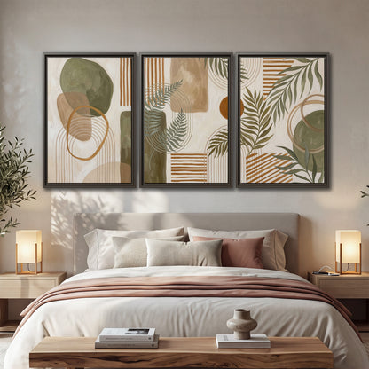 Green botanical leaves layered with ochre and cream geometric forms 3 piece framed canvas wall art displayed in a bedroom