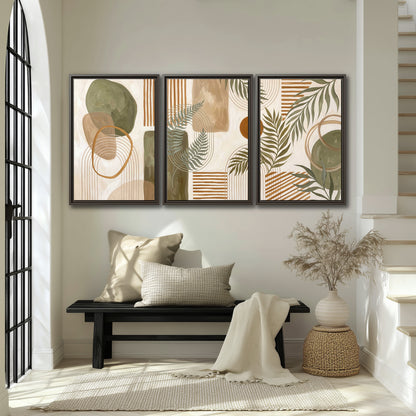 Green botanical leaves layered with ochre and cream geometric forms 3 piece framed canvas wall art displayed in a entryway