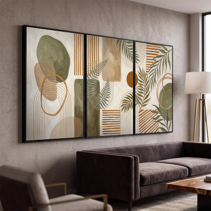 Green botanical leaves layered with ochre and cream geometric forms 3 piece framed canvas wall art displayed in a modern living room