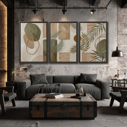 Green botanical leaves layered with ochre and cream geometric forms 3 piece framed canvas wall art displayed in a industrial room