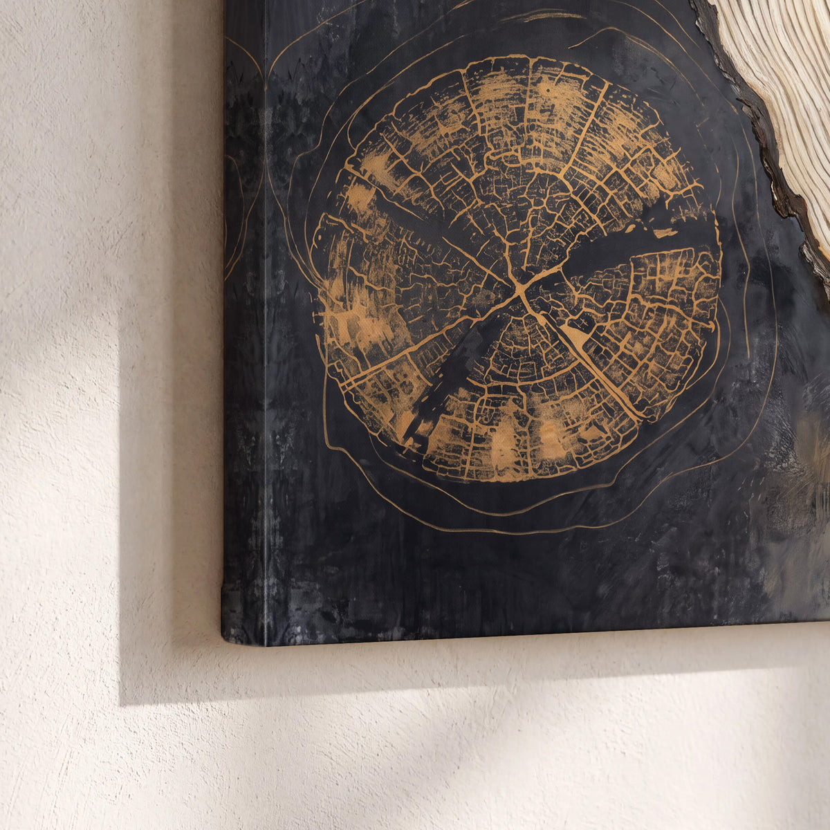 Circular tree-ring motifs in charcoal, cream and gold tones 3 piece canvas wall art material and edge close up