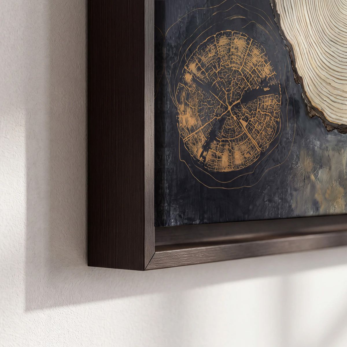 Circular tree-ring motifs in charcoal, cream and gold tones 3 piece framed canvas wall art material and edge close up